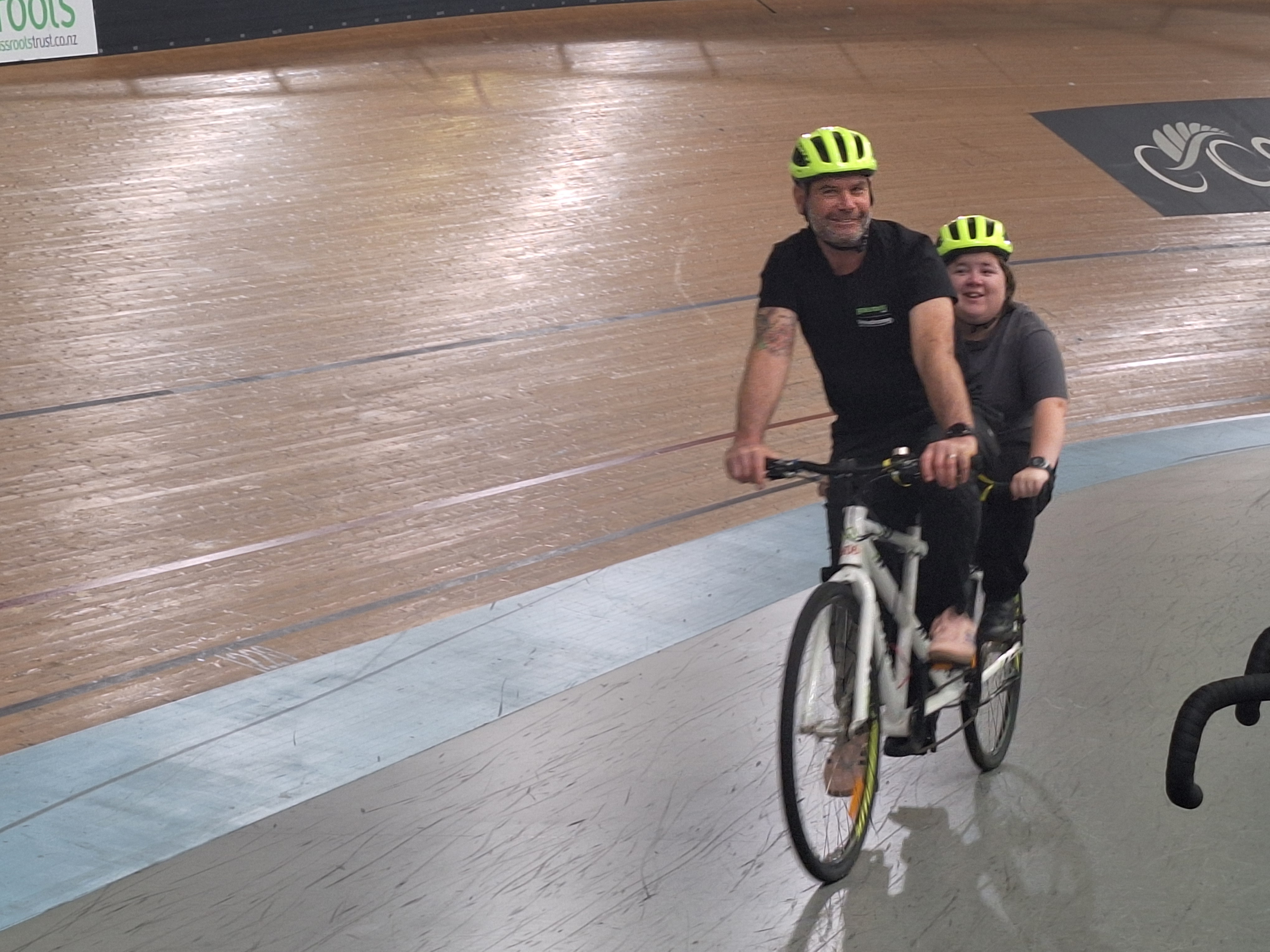 Figure 1 A Tandem bike riding around the velodrome with a BLENNZ akonga on the back and a pilot person at the front