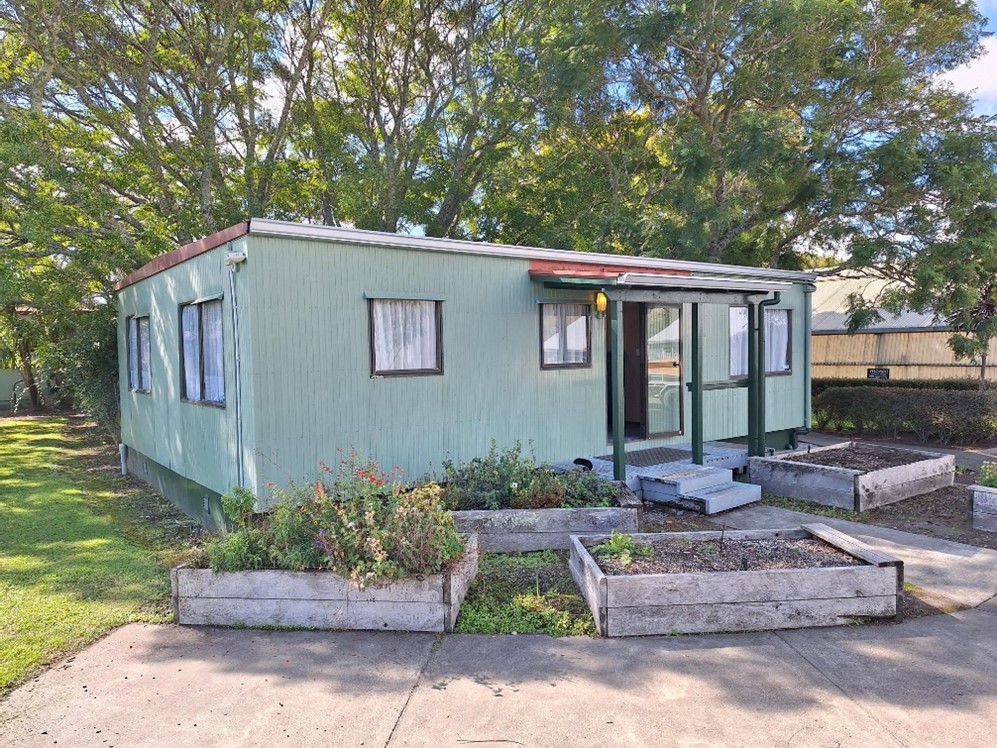 Figure 1 The new BLENNZ office at EIT Rural Campus in Gisborne surrounded by fruit trees luscious gardens and busy beehives.