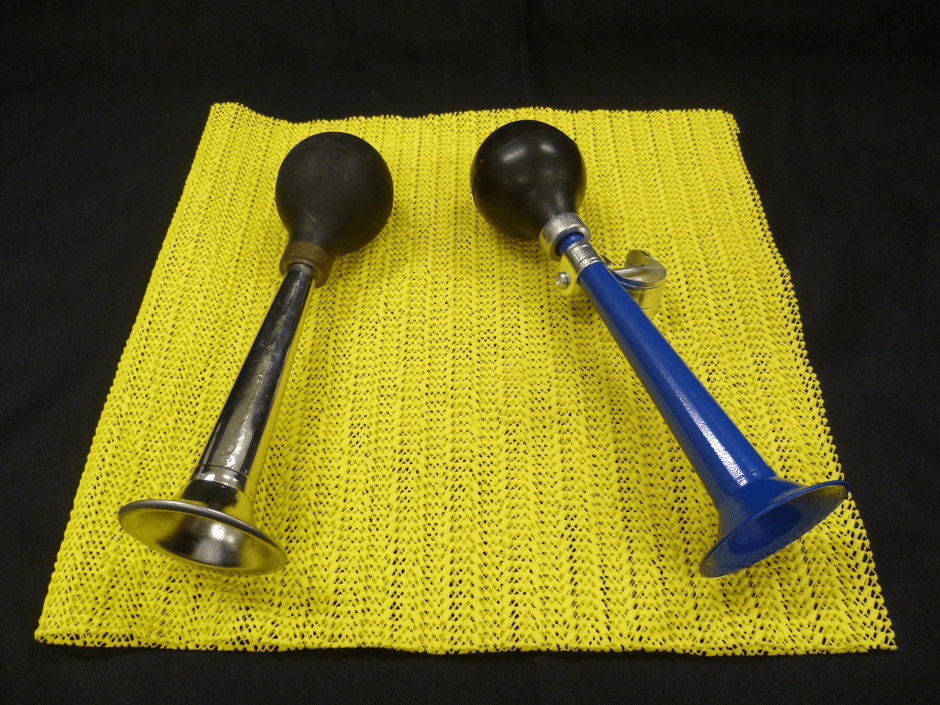 Two metal bike horns with squeezable rubber ball to activate.