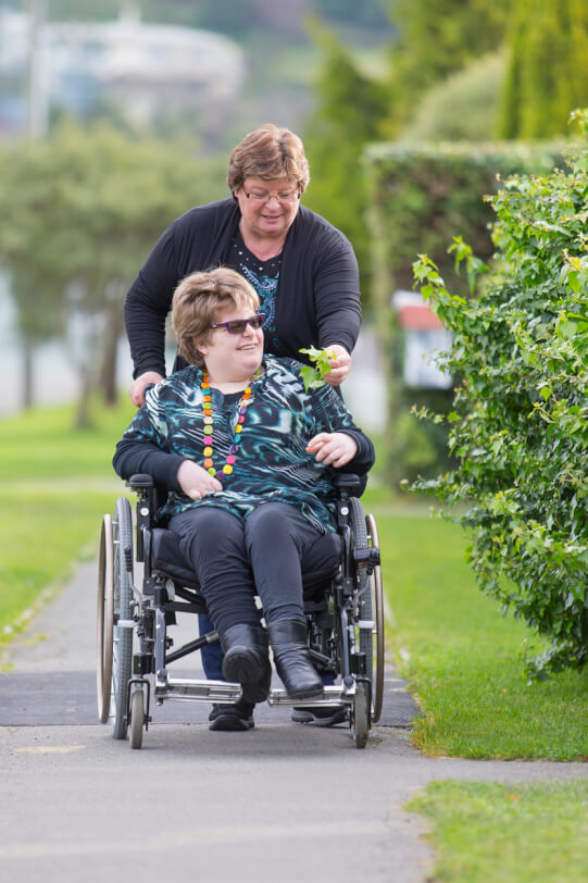 Katelyn and her mum walking outside.
