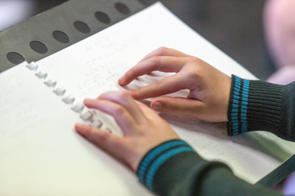 Fingers on a braille page