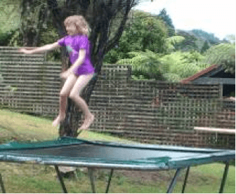 A child jumping on a trampoline