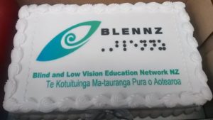 Cake with white icing and BLENNZ logo