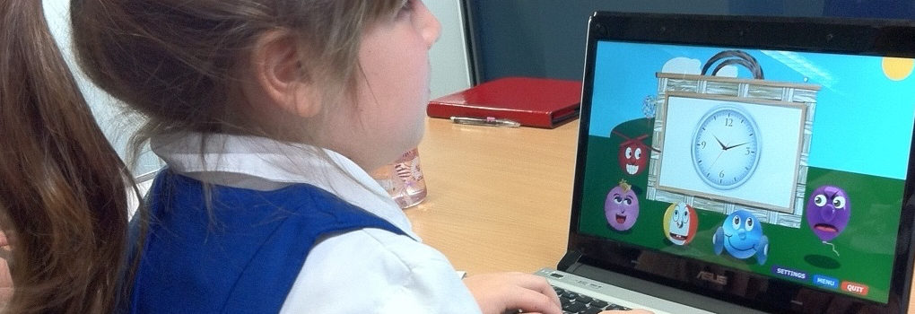 Young girl who is blind using the keyboard while playing with Ballyland