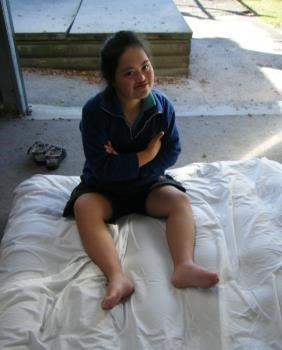 Young learner is sitting on an airbed