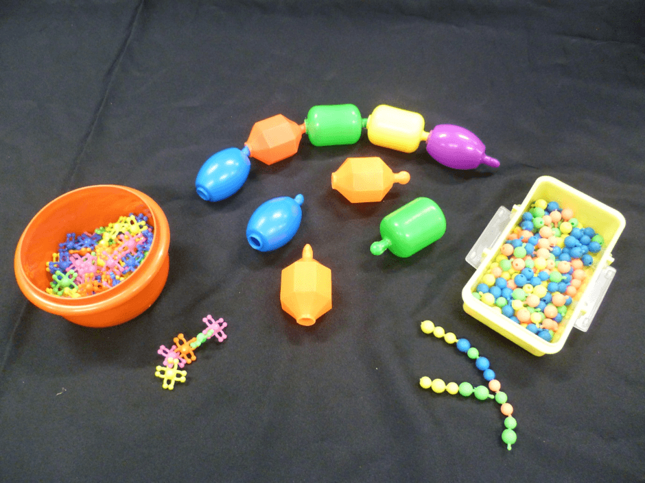 Three varieties of pop beads of different sizes