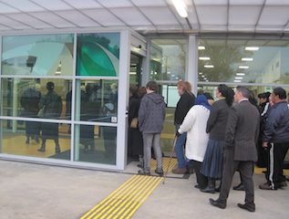 Group of people entering the new building