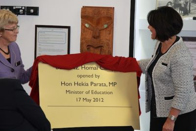Hekia standing to the left of new plaque