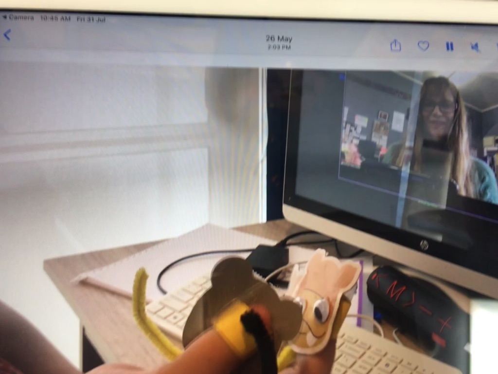 Figure 1 - A BLENNZ ākonga holding up her monkey finger puppets to act out a poem during a Zoom session with her RTV.