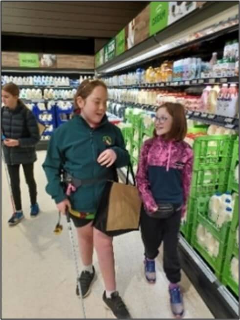 Figure 1 - Chevarni and Carrie orientating their way safely around the supermarket side by side in the aisle
